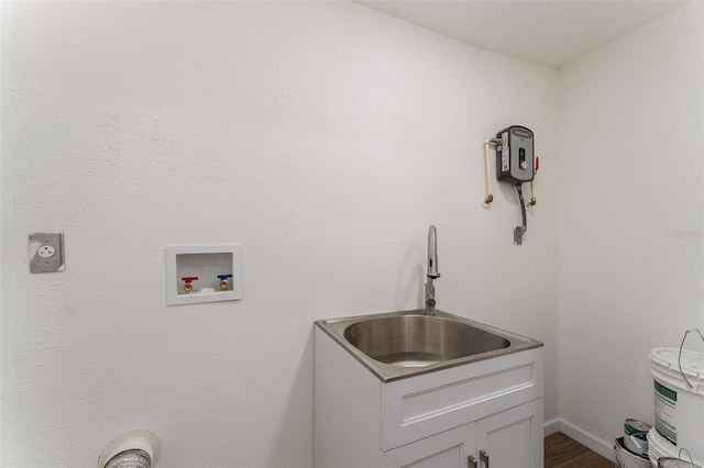 833 N Suwannee Ave, Lakeland, FL 33815 - laundry area with hookup for a washing machine, dark wood-style floors, and cabinet space