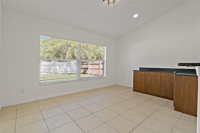 19206 Ivy Oak Way, Tampa, FL 33647 - spare room with vaulted ceiling, recessed lighting, and light tile patterned flooring