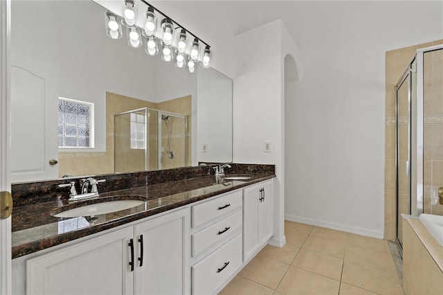 19206 Ivy Oak Way, Tampa, FL 33647 - full bathroom featuring a stall shower, double vanity, and tile patterned flooring