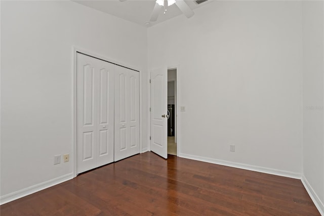 19206 Ivy Oak Way, Tampa, FL 33647 - unfurnished bedroom featuring dark wood-style flooring, a closet, and a ceiling fan