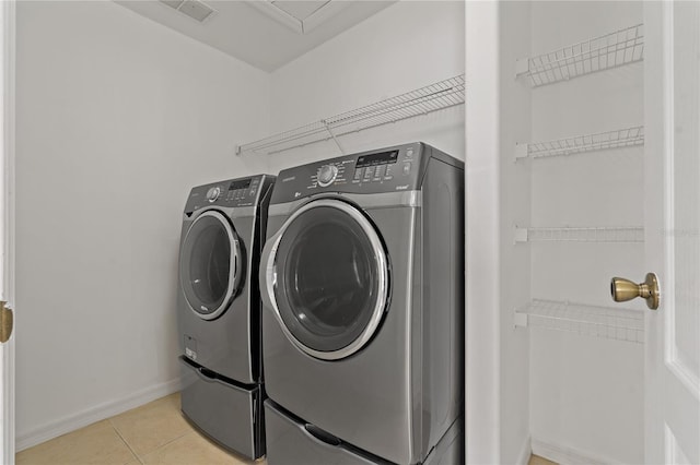 19206 Ivy Oak Way, Tampa, FL 33647 - washroom featuring independent washer and dryer and light tile patterned floors