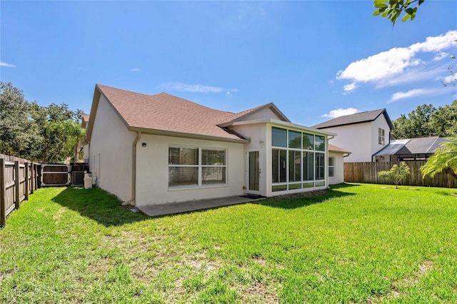 19206 Ivy Oak Way, Tampa, FL 33647 - back of property with stucco siding, a fenced backyard, and a sunroom