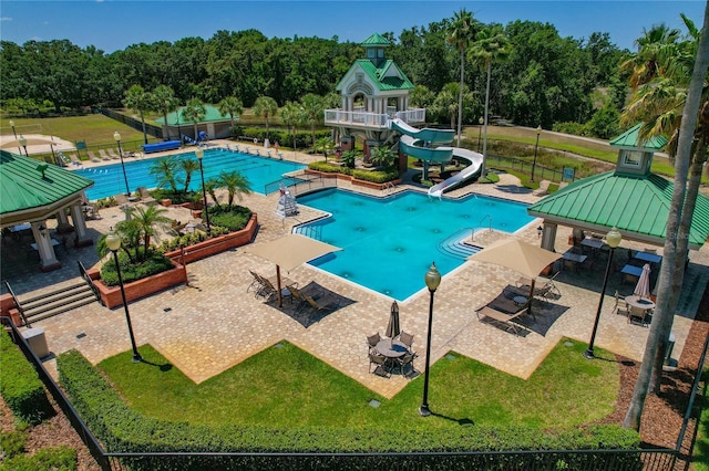 19206 Ivy Oak Way, Tampa, FL 33647 - community pool with a gazebo, a water slide, a patio, and view of scattered trees