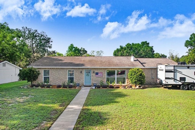 901 Strawberry Ln, Brandon, FL 33511 - ranch-style home with a front lawn and stone siding