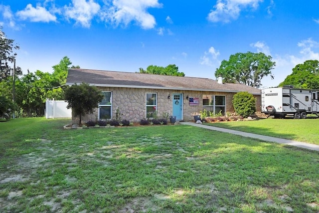 901 Strawberry Ln, Brandon, FL 33511 - single story home featuring a front yard and stone siding