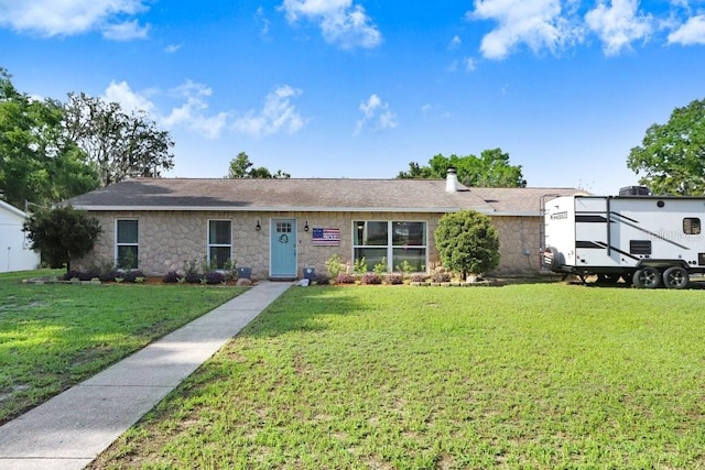 901 Strawberry Ln, Brandon, FL 33511 - ranch-style home with a front lawn and stone siding