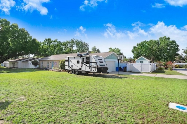 901 Strawberry Ln, Brandon, FL 33511 - view of front of home with a gate, concrete driveway, and a garage