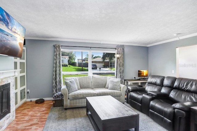 901 Strawberry Ln, Brandon, FL 33511 - living room featuring a textured ceiling, a glass covered fireplace, and crown molding