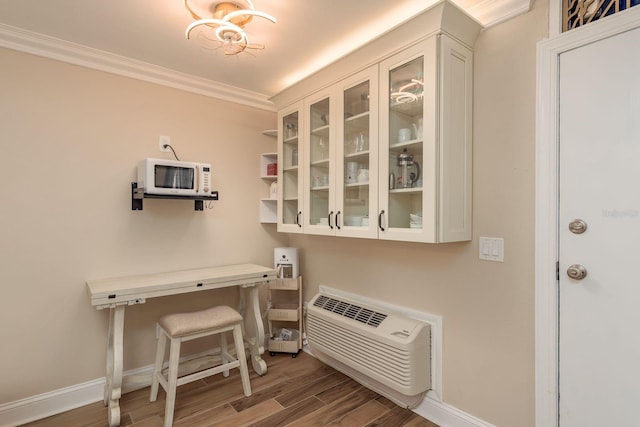 1301 S Howard Ave Unit A9, Tampa, FL 33606 - office area with wood finished floors, crown molding, and an AC wall unit