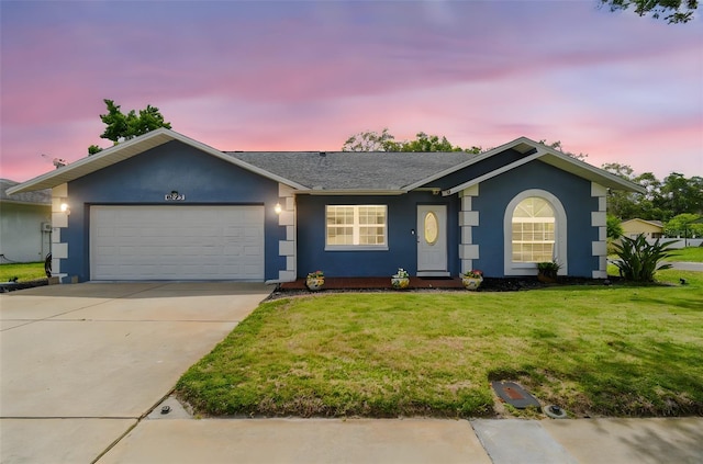 8823 Aruba Ln, Port Richey, FL 34668 - ranch-style house featuring stucco siding, a garage, a front lawn, and concrete driveway