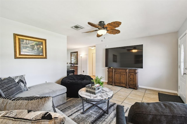 8823 Aruba Ln, Port Richey, FL 34668 - living area with ceiling fan and light tile patterned floors