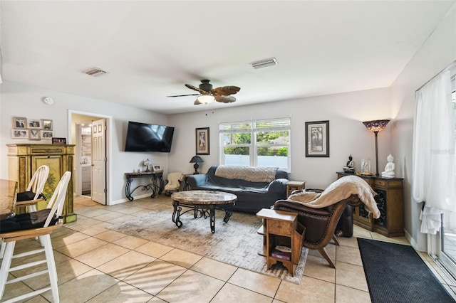8823 Aruba Ln, Port Richey, FL 34668 - living room featuring light tile patterned flooring and ceiling fan