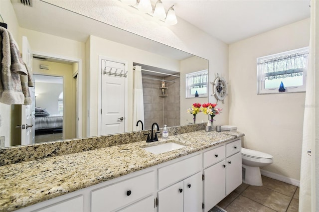 8823 Aruba Ln, Port Richey, FL 34668 - full bathroom with vanity, a tile shower, and tile patterned floors