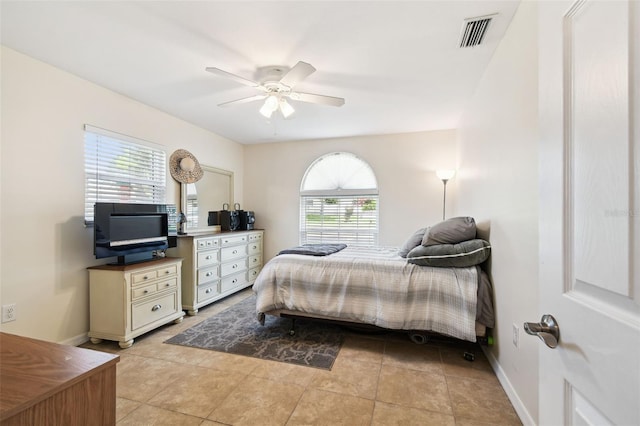 8823 Aruba Ln, Port Richey, FL 34668 - bedroom featuring light tile patterned floors and a ceiling fan