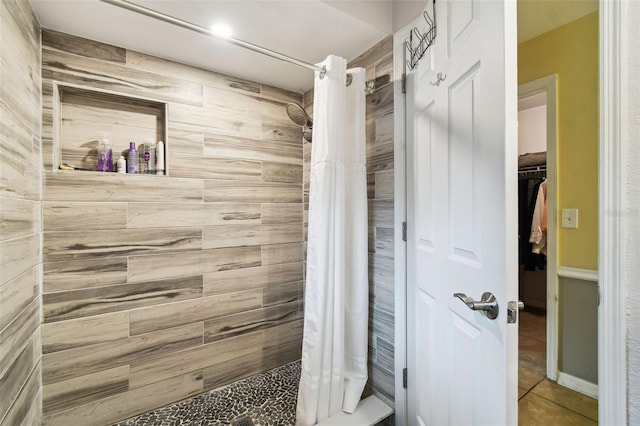 8823 Aruba Ln, Port Richey, FL 34668 - bathroom with a shower stall and tile patterned floors