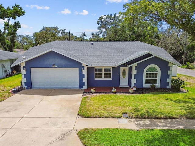 8823 Aruba Ln, Port Richey, FL 34668 - single story home featuring a shingled roof, stucco siding, a garage, and a front yard