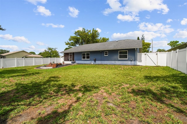 8823 Aruba Ln, Port Richey, FL 34668 - back of property with a fenced backyard, stucco siding, and a gate