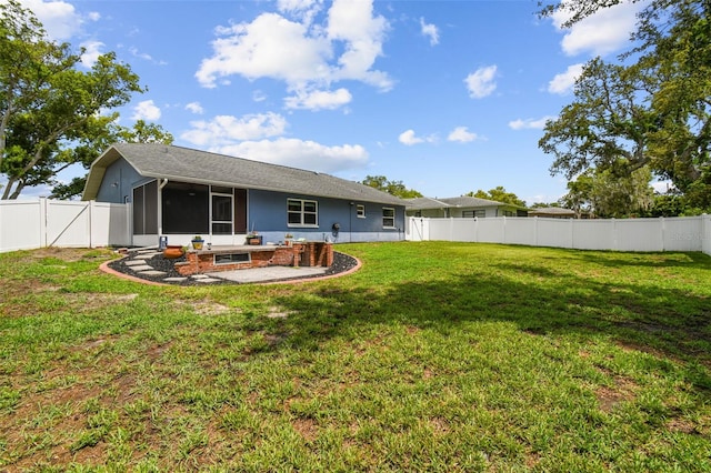 8823 Aruba Ln, Port Richey, FL 34668 - back of house with a sunroom, a fenced backyard, and a patio