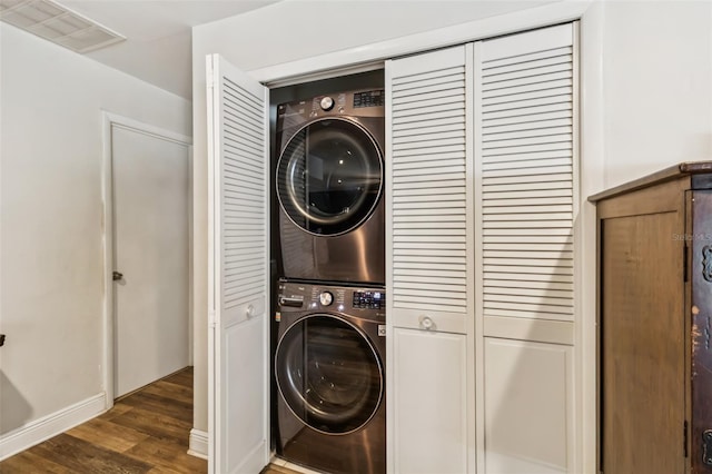 2199 Blue Tern Dr, Palm Harbor, FL 34683 - washroom with estacked washer and dryer and wood finished floors