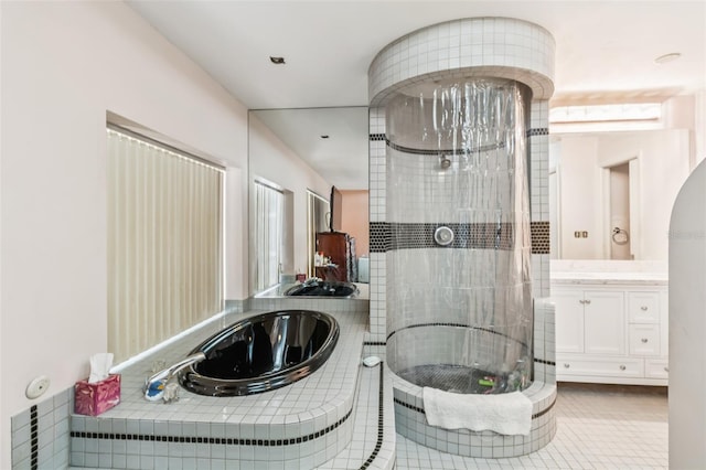 2199 Blue Tern Dr, Palm Harbor, FL 34683 - full bath with vanity, a garden tub, a tile shower, and tile patterned flooring
