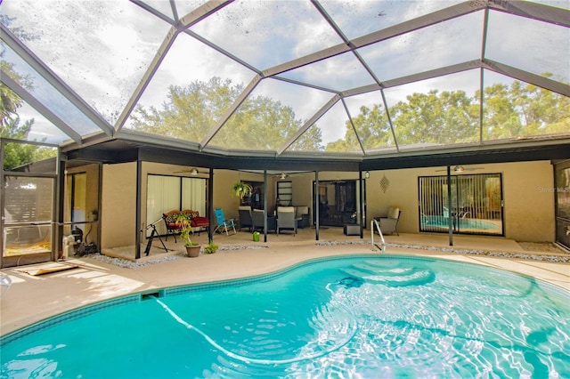 2199 Blue Tern Dr, Palm Harbor, FL 34683 - swimming pool featuring a ceiling fan, a patio area, and a lanai