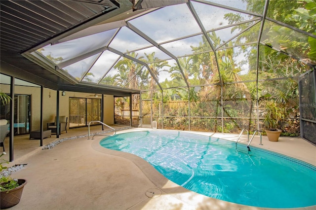 2199 Blue Tern Dr, Palm Harbor, FL 34683 - swimming pool featuring a patio, a ceiling fan, and glass enclosure