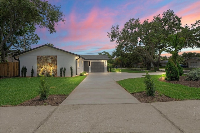 1707 Solon Ave, Dunedin, FL 34698 - view of front facade featuring concrete driveway, a garage, and stucco siding