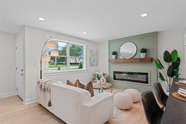 1707 Solon Ave, Dunedin, FL 34698 - living room featuring wood finished floors, recessed lighting, and a glass covered fireplace