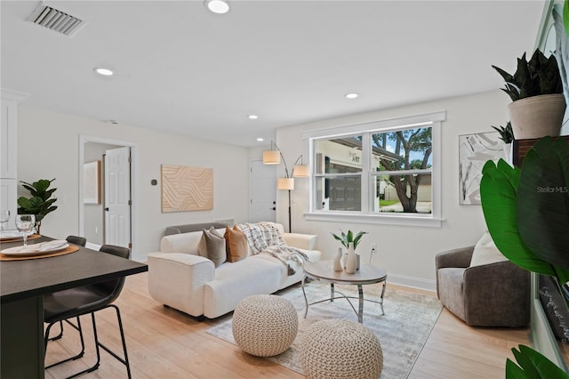 1707 Solon Ave, Dunedin, FL 34698 - living area featuring light wood finished floors and recessed lighting