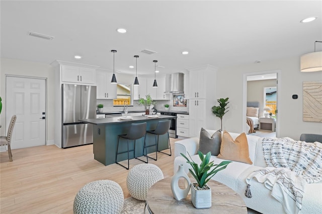 1707 Solon Ave, Dunedin, FL 34698 - living area with light wood finished floors and recessed lighting