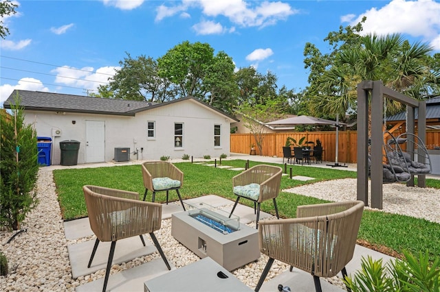 1707 Solon Ave, Dunedin, FL 34698 - view of patio / terrace featuring an outdoor fire pit