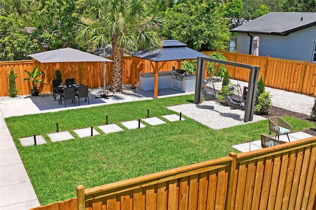 1707 Solon Ave, Dunedin, FL 34698 - fenced backyard with a patio and a gazebo