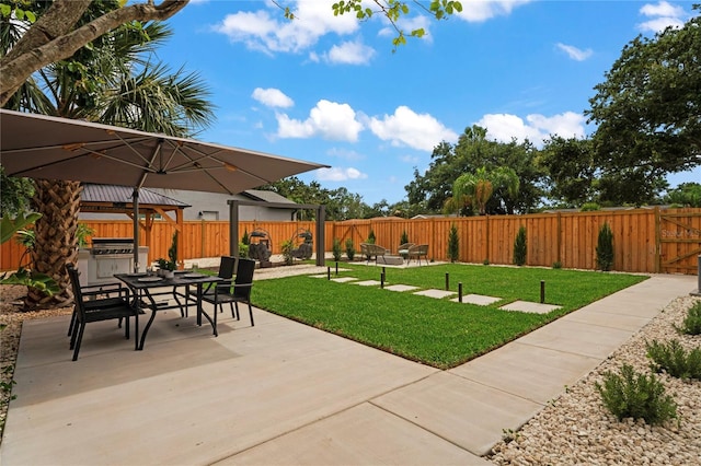 1707 Solon Ave, Dunedin, FL 34698 - fenced backyard featuring outdoor dining space, a patio area, and a gazebo
