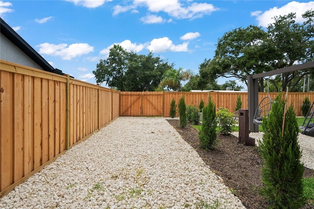 1707 Solon Ave, Dunedin, FL 34698 - fenced backyard featuring a gate