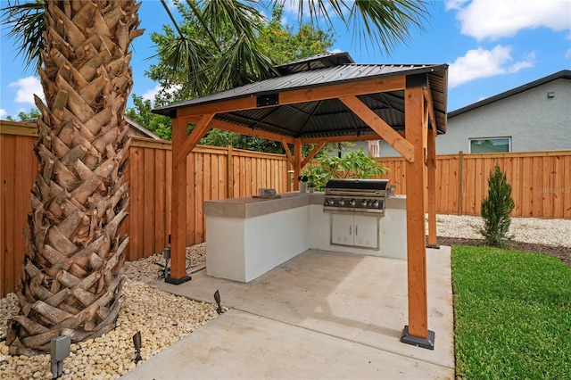 1707 Solon Ave, Dunedin, FL 34698 - fenced backyard featuring exterior kitchen, a patio area, and a gazebo
