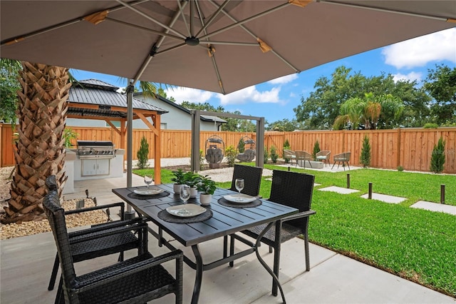 1707 Solon Ave, Dunedin, FL 34698 - fenced backyard featuring outdoor dining space, a patio area, area for grilling, and a gazebo
