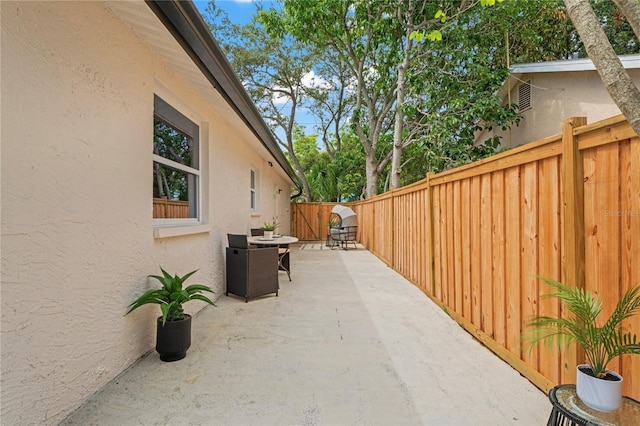 1707 Solon Ave, Dunedin, FL 34698 - fenced backyard with a patio area and area for grilling