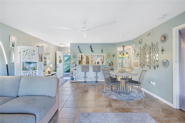 5725 Pelican Pointe Dr Unit 1, Sebastian, FL 32958 - tiled living area featuring ceiling fan and baseboards