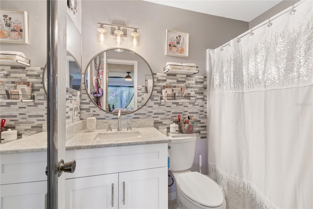 5725 Pelican Pointe Dr Unit 1, Sebastian, FL 32958 - full bathroom featuring tasteful backsplash, vanity, a shower with shower curtain, and tile walls