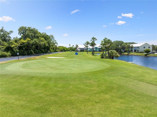 5725 Pelican Pointe Dr Unit 1, Sebastian, FL 32958 - surrounding community with a water view, golf course view, and a yard