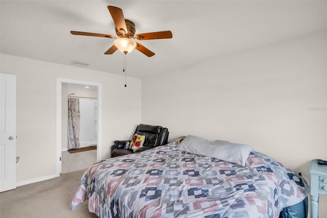 7774 Sail Clover Ln, Zephyrhills, FL 33540 - bedroom featuring light carpet, a ceiling fan, and connected bathroom