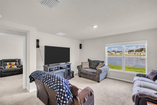 7774 Sail Clover Ln, Zephyrhills, FL 33540 - living room featuring light colored carpet and a textured ceiling