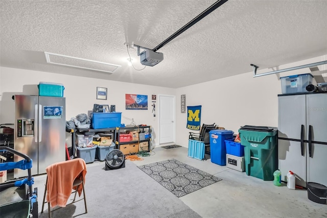 7774 Sail Clover Ln, Zephyrhills, FL 33540 - garage with stainless steel refrigerator with ice dispenser and a garage door opener