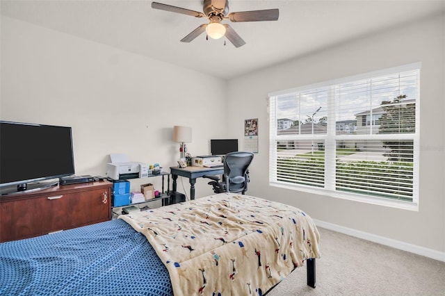7774 Sail Clover Ln, Zephyrhills, FL 33540 - carpeted bedroom featuring a ceiling fan and a desk