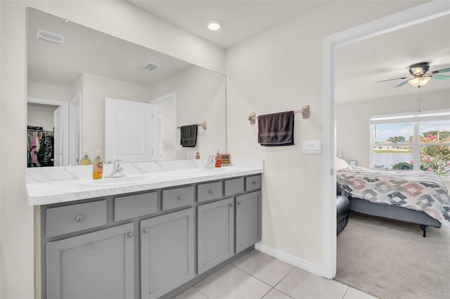 7774 Sail Clover Ln, Zephyrhills, FL 33540 - full bath with vanity, ceiling fan, tile patterned flooring, ensuite bath, and a walk in closet