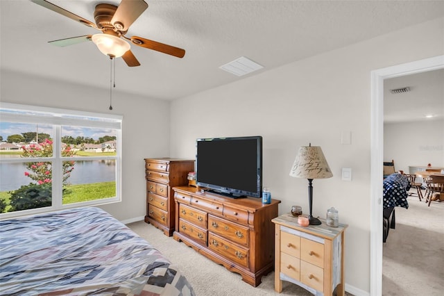 7774 Sail Clover Ln, Zephyrhills, FL 33540 - bedroom featuring light carpet and a ceiling fan