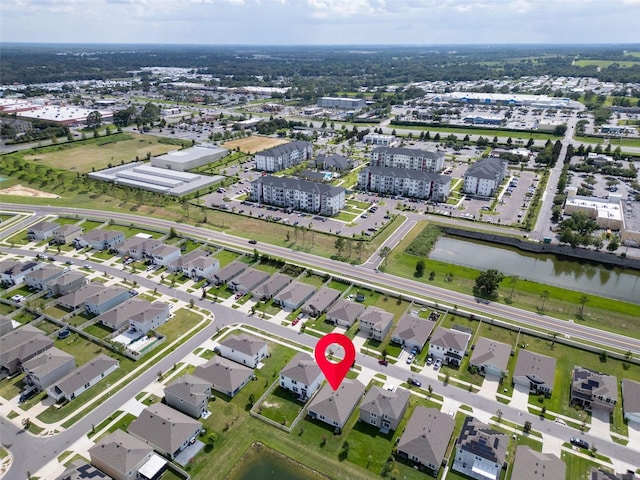 7774 Sail Clover Ln, Zephyrhills, FL 33540 - aerial view of property and surrounding area featuring a large body of water and nearby suburban area
