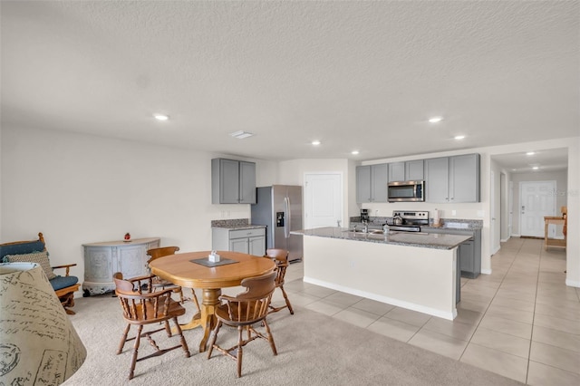 7774 Sail Clover Ln, Zephyrhills, FL 33540 - dining area with light tile patterned floors, recessed lighting, and a textured ceiling