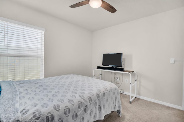 7774 Sail Clover Ln, Zephyrhills, FL 33540 - carpeted bedroom with baseboards and a ceiling fan