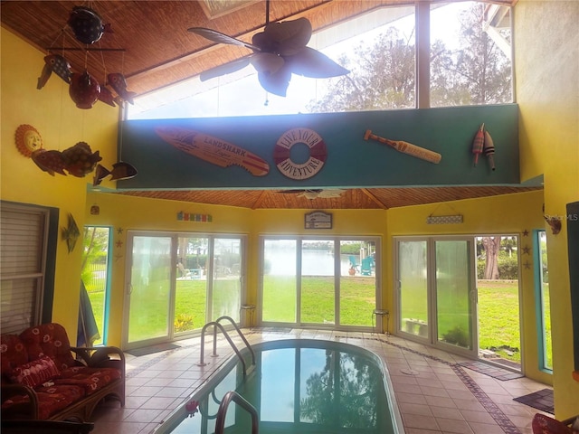 1626 Sea Breeze Dr, Tarpon Springs, FL 34689 - sunroom / solarium with tile patterned floors, high vaulted ceiling, inlaid floor details, and wooden ceiling